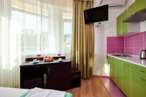 Изображение Изображение: Одноместный номер Делюкс с видом на сад и горы #1 #13