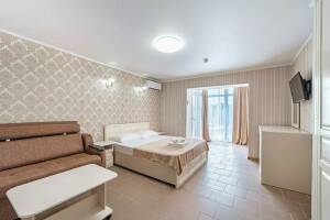 Изображение Изображение: Четырехместный номер Делюкс с балконом с завтраком #1 #9