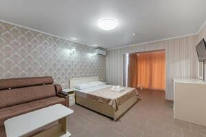 Изображение Изображение: Четырехместный номер Делюкс с балконом #1 #8