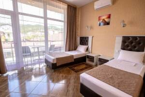 Изображение Изображение: Двухместный номер с двумя отдельными кроватями #1 #2