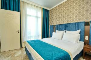 Изображение Изображение: Двухкомнатный пятиместный номер с балконом #1 #1