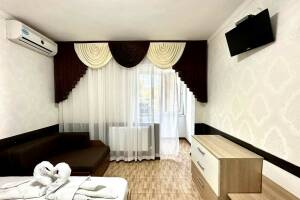 Изображение Изображение: Двухкомнатный 4-хместный номер с доп. местом #1 #3