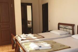 Изображение Изображение: Стандарт с 3 отдельными кроватями вид на море #1 #4