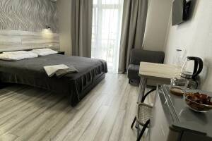 Изображение Изображение: Двухместный номер с балконом на третьем этаже #1 #4