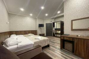 Изображение Изображение: Четырехместный «Делюкс» с балконом завтраком #1 #27