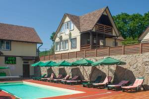 Изображение отеля / гостиницы "Комплекс коттеджей в Голубой даче «Буэнос Диас»"